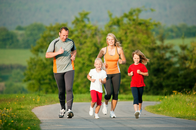 Family Jogging Outdoors With