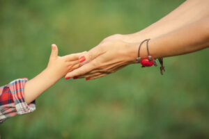 Hand Of Parent And Child