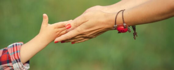 Hand Of Parent And Child